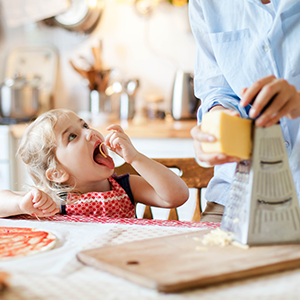 Mother and daughter preparing pizza